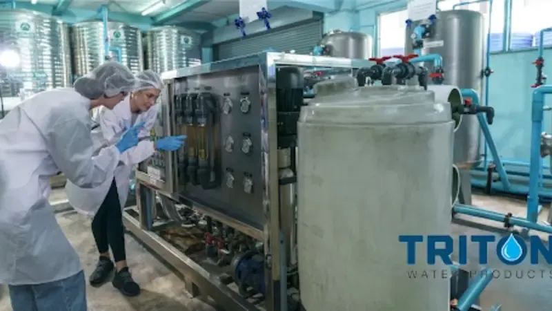 Technicians inspecting hard water filtration systems LA for cleaner whole-home water